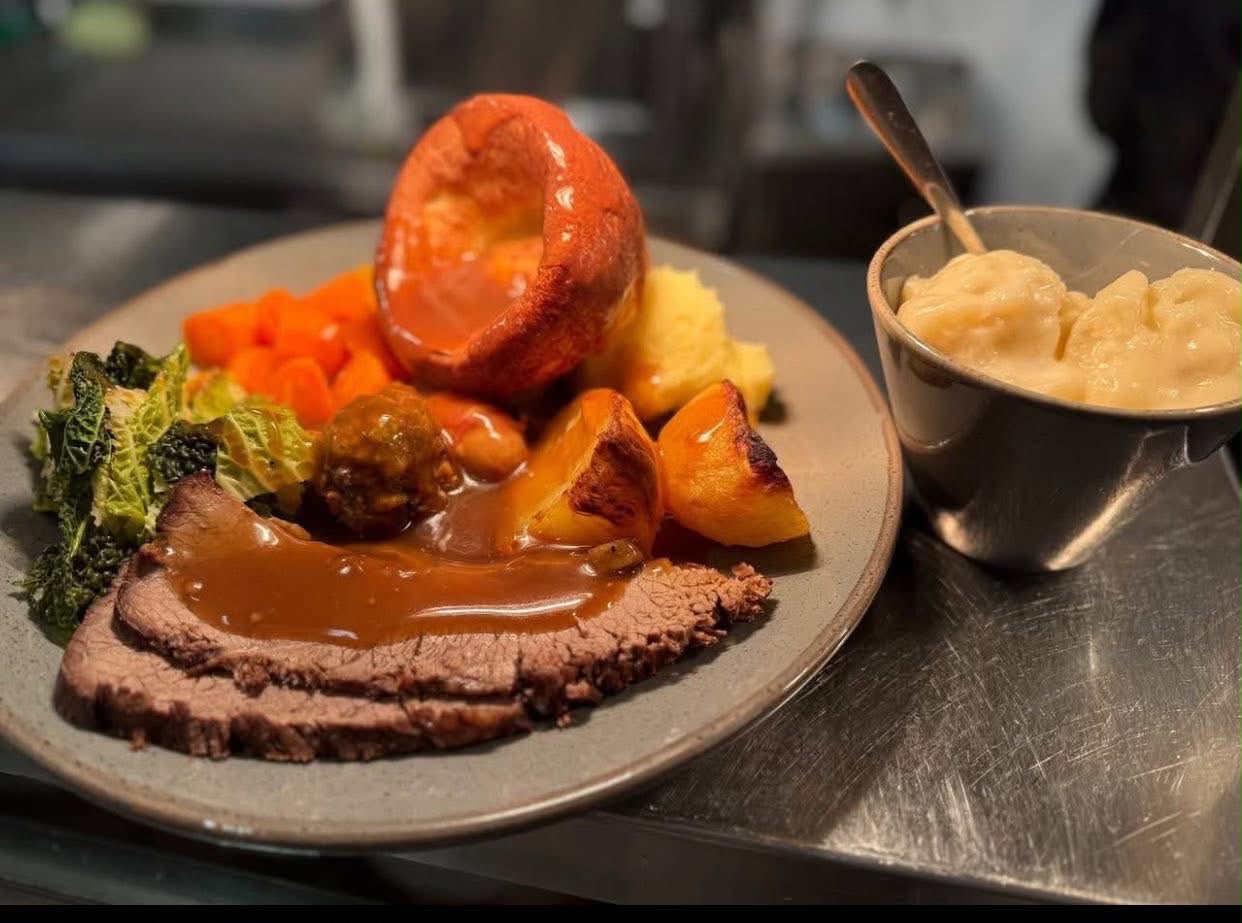 Sunday roast beef with Yorkshire pudding, roast potatoes and cauliflower cheese
