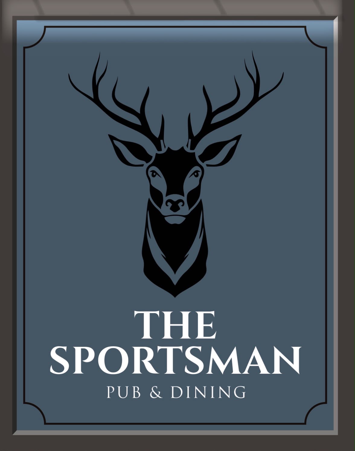 The Sportsman hanging pub sign with the stag emblem